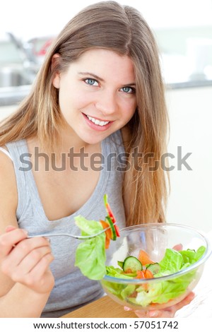 Charming woman with food in a kitchen
