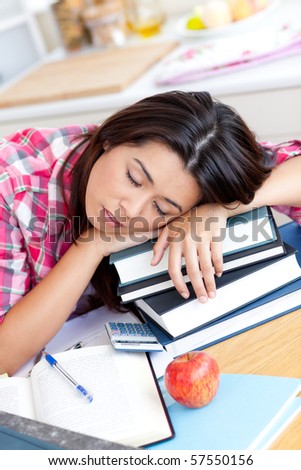 stock photo Closeup of a tired caucasian teen girl studying at home