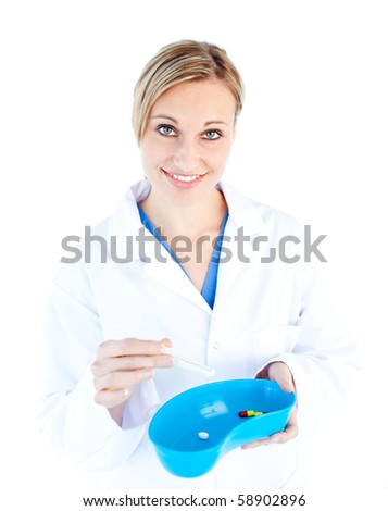 Charismatic female doctor holding capsule against white background