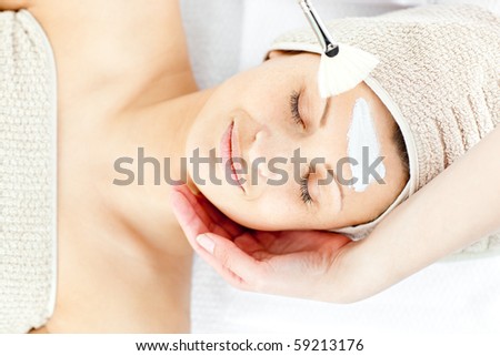 Beautiful relaxed woman receiving a beauty treatment in a spa center
