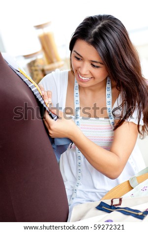 http://image.shutterstock.com/display_pic_with_logo/76219/76219,1282116275,61/stock-photo-pretty-asian-woman-sewing-clothes-in-the-kitchen-at-home-59272321.jpg