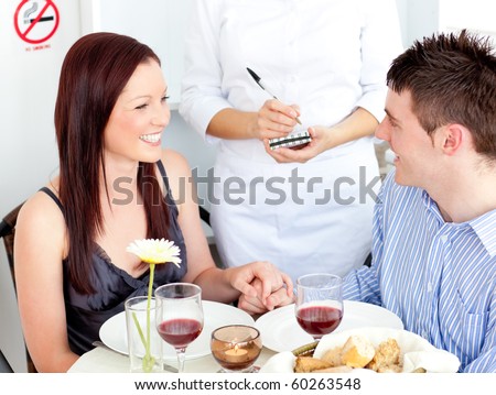 Enthusiastic couple dining at the restaurant