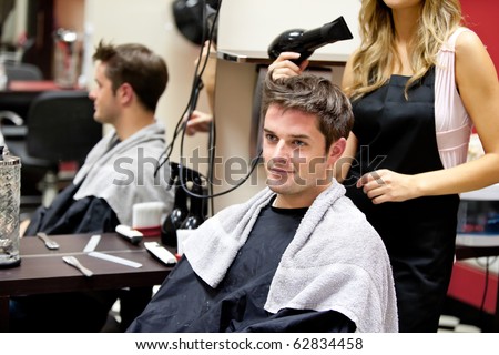 Portrait of a customer with a female hairdresser in a salon