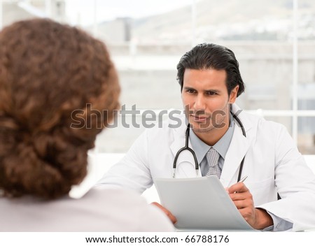 Charismatic doctor during an appointment with a female patient