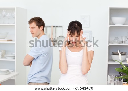 Young lovers having dispute in the kitchen at home