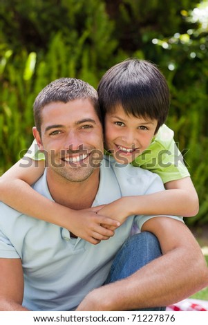 Father with his son hugging in the garden
