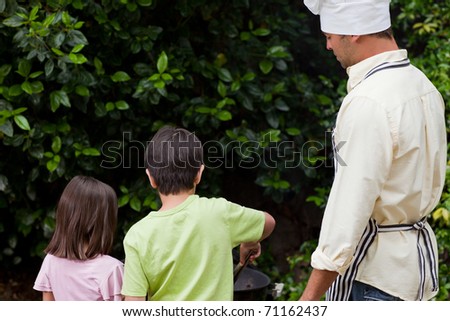 Family  having a barbecue in the garden