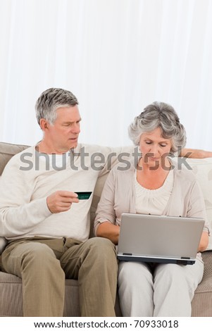 Seniors buying something on internet at home