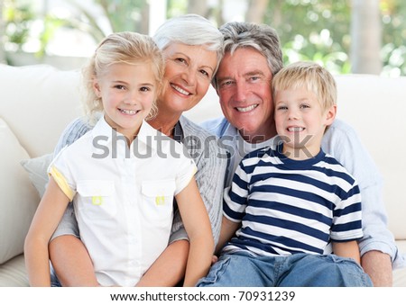 Happy family looking at the camera