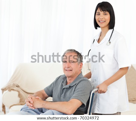Nurse with her patient looking at the camera