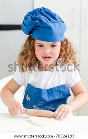 Little girl baking in the kitchen at home