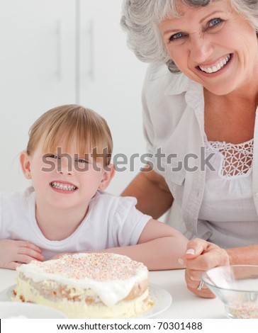 Lovely girl and her grandmother looking at the camera