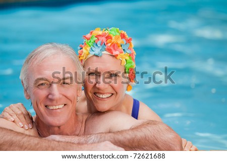 Happy mature couple in the swimming pool
