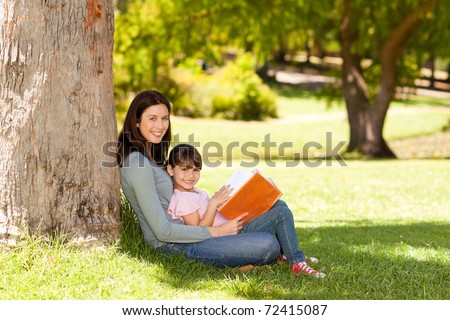 Joyful mother with her daughter in the park