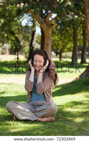 Woman listening to some music in the garden