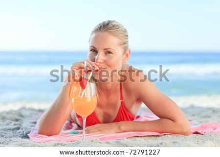 Cute woman drinking her cocktail