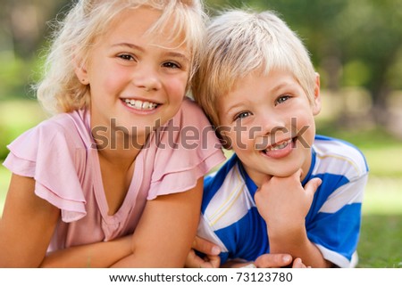 Boy with his sister in the park