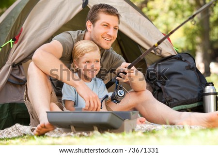 Father fishing with his son