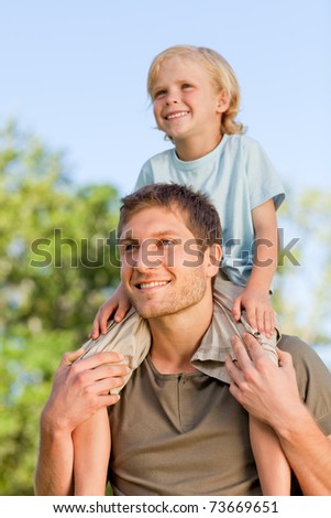 Father giving son a piggyback