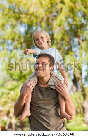 Happy father giving son a piggyback