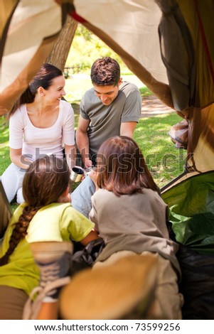 Happy family camping in the park