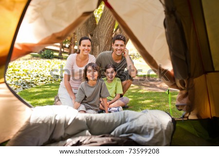 Joyful family camping in the park