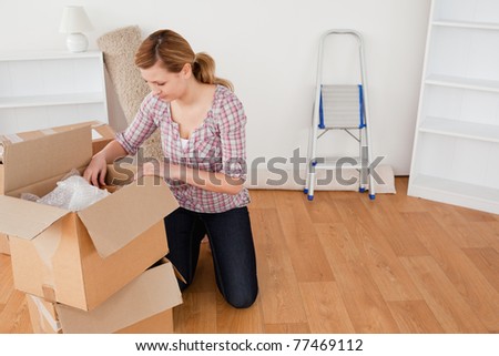 Blond-haired woman preparing to move house