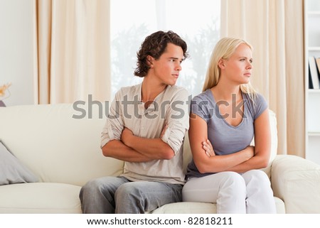 Man angry at her wife with the arms crossed