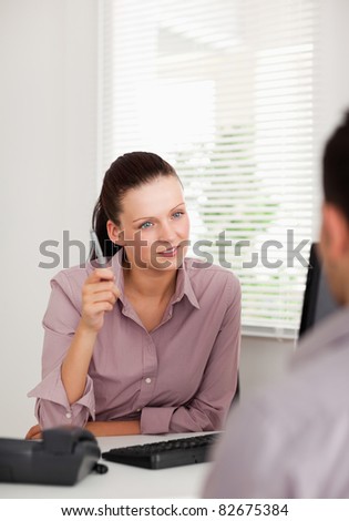 A businesswoman is talking to someone