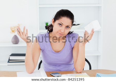 An unenthusiastic young woman is accounting