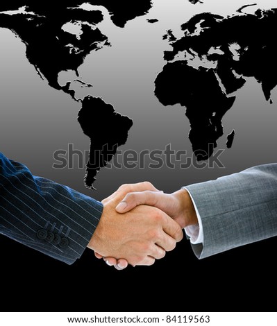 Close-up of a business people shaking hands against a black worldmap