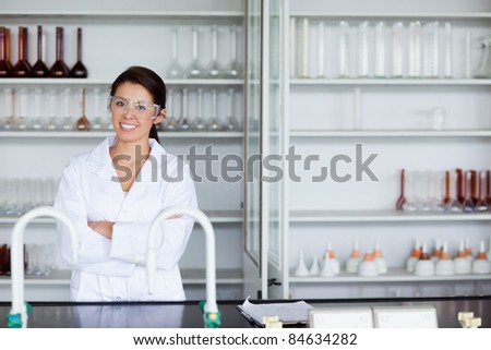 Smiling science student posing in a laboratory