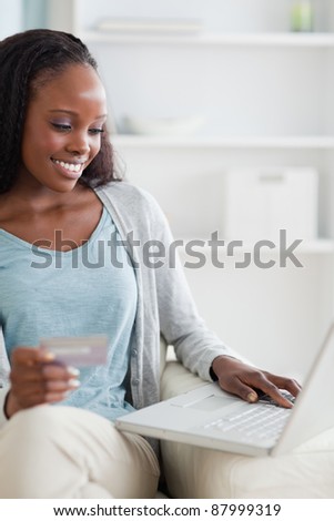 Close up of smiling woman shopping online