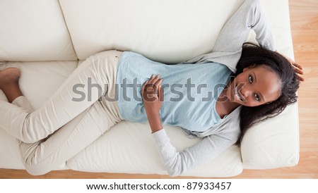 Smiling woman taking a break on the couch