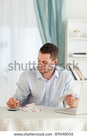 Young businessman doing accounting