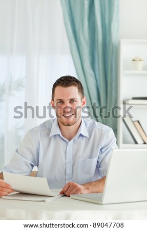 Young businessman happy about a letter