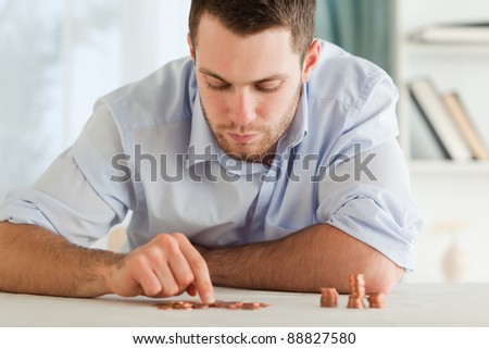 Young businessman counting his small change