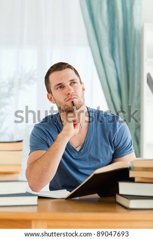 Male student thinking about subject material