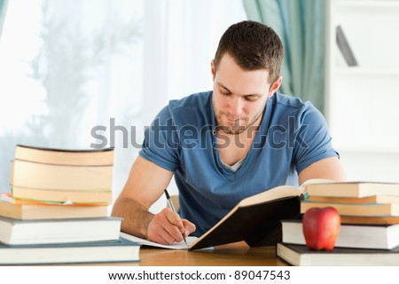 Male student working through his books