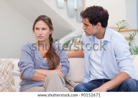 Woman being mad at her boyfriend in their living room