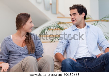 Couple having a discussion in their living room