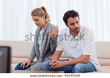 Woman being mad at her fiance in their living room