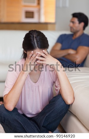 Portrait of a couple mad at each other in their living room