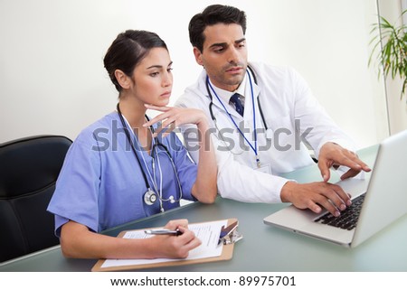 Young doctors working with a notebook in an office