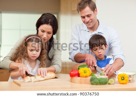 Family slicing ingredients together