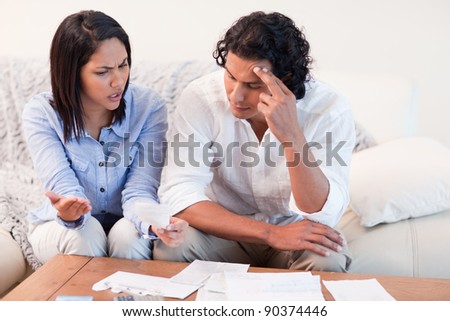 Young couple talking about financial problems