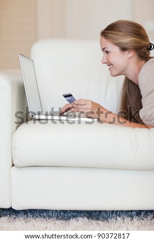 Portrait of a young woman shopping online in her living room