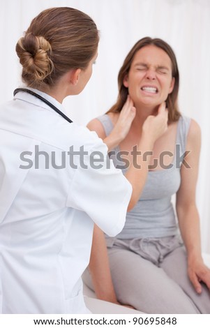 Doctor examining patients painful jaw