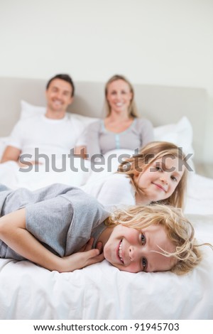 Family taking a rest together on the bed
