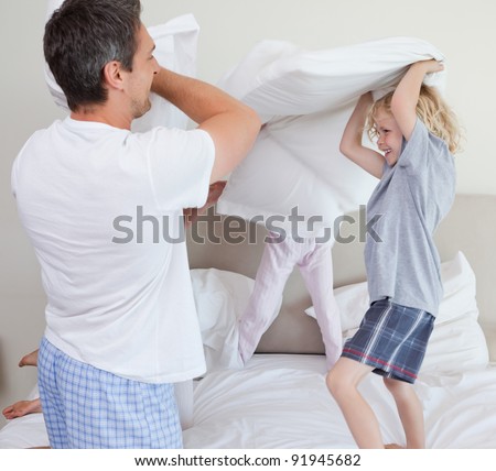 Family having a pillow fight together